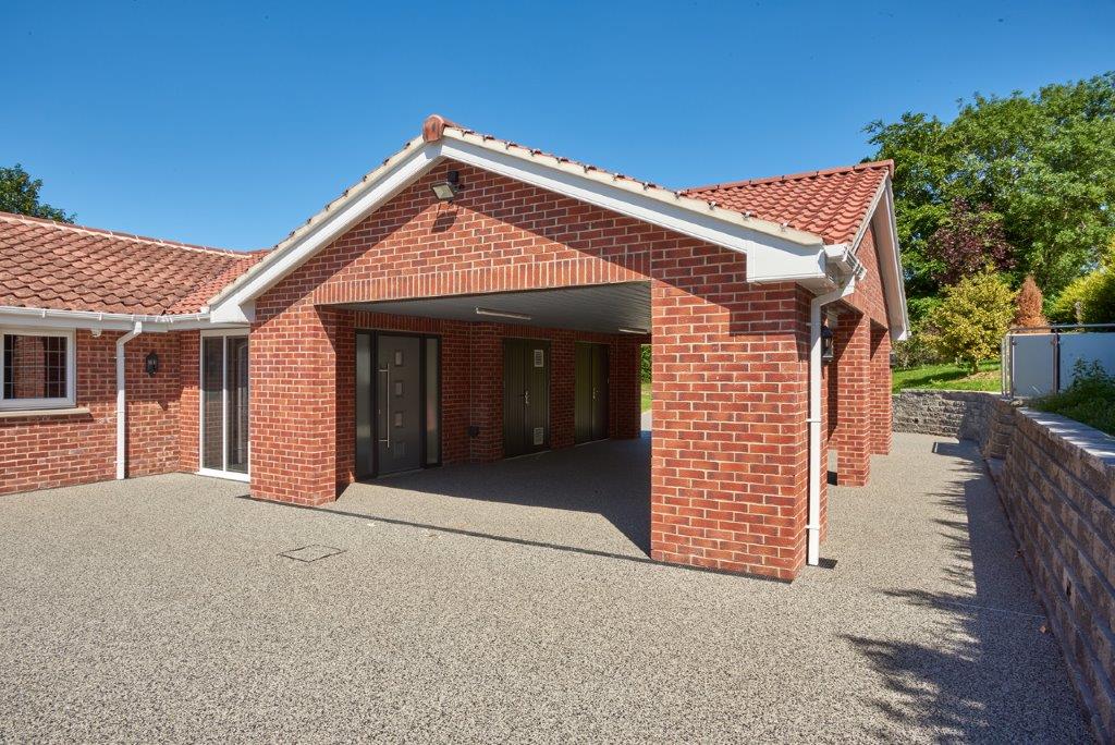 Covered accessible entrance and parking area